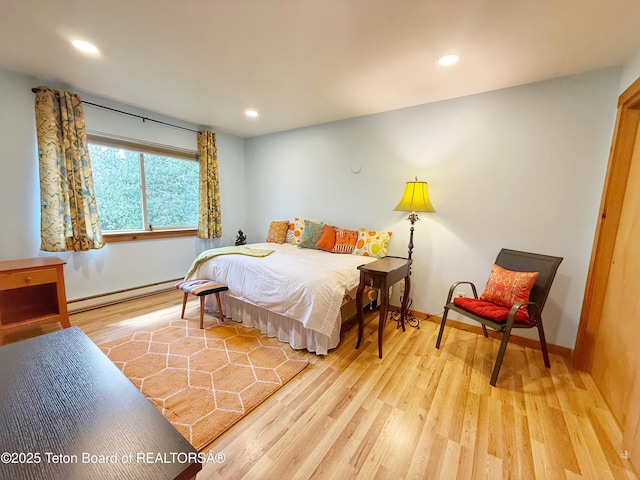 200 Homestead Rd Unit 309, Victor, ID 83455 - bedroom featuring baseboard heating, wood finished floors, and recessed lighting