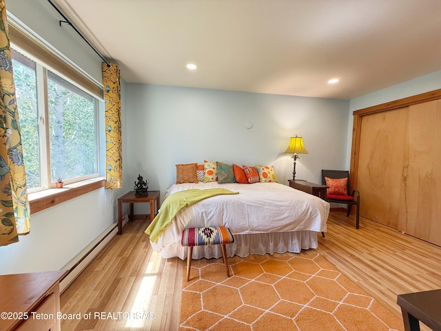 200 Homestead Rd Unit 309, Victor, ID 83455 - bedroom featuring baseboard heating, wood finished floors, recessed lighting, and a closet