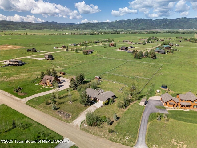 7302 Lakeside Rd, Victor, ID 83455 - aerial overview of property's location with rural landscape and a mountain backdrop