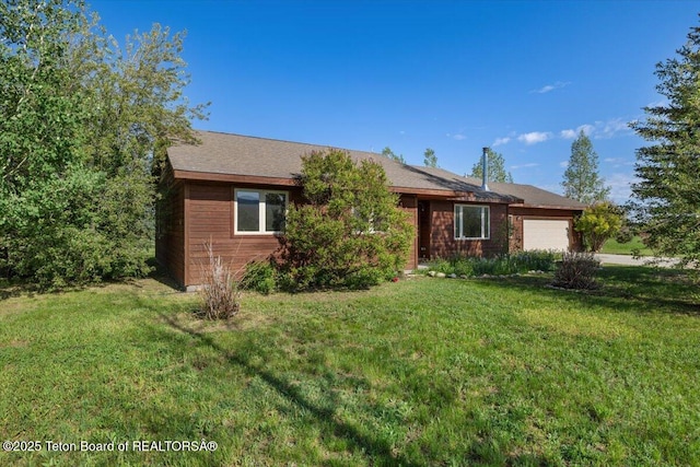 7302 Lakeside Rd, Victor, ID 83455 - ranch-style house with an attached garage and a front yard