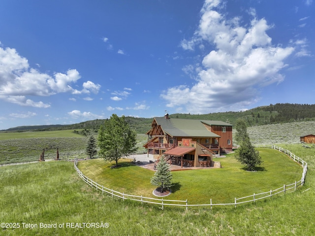 1802 Dusty Trl, Auburn, WY 83111 - rear view of house with a view of countryside, a deck, and stairs