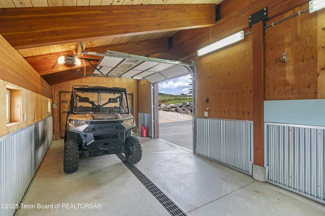 1802 Dusty Trl, Auburn, WY 83111 - garage featuring a garage door opener and wood walls