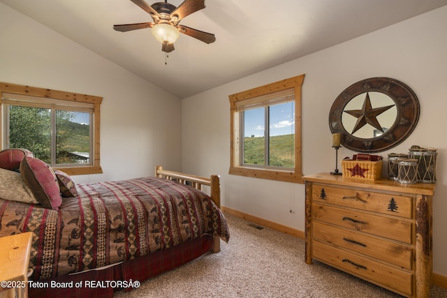 1802 Dusty Trl, Auburn, WY 83111 - bedroom with vaulted ceiling, light colored carpet, and a ceiling fan