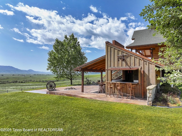 1802 Dusty Trl, Auburn, WY 83111 - view of yard featuring a mountain view and a patio area