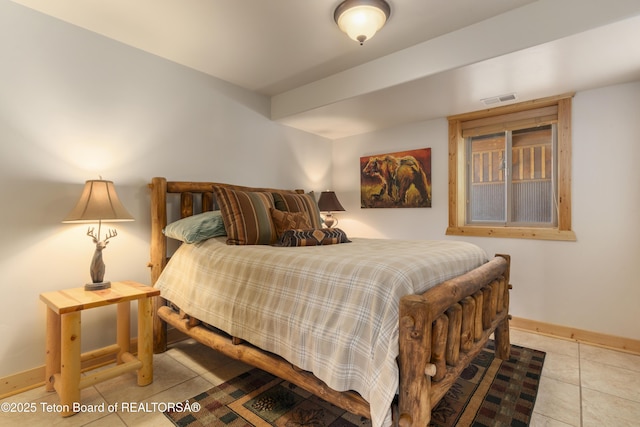 1802 Dusty Trl, Auburn, WY 83111 - bedroom with tile patterned flooring and baseboards