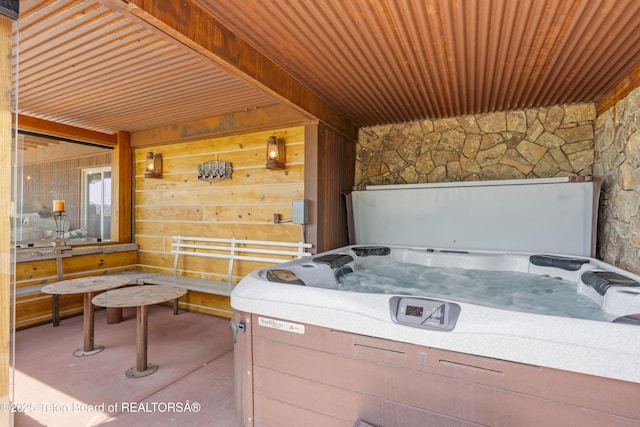 1802 Dusty Trl, Auburn, WY 83111 - miscellaneous room featuring wood ceiling, a jacuzzi, wood walls, and concrete floors