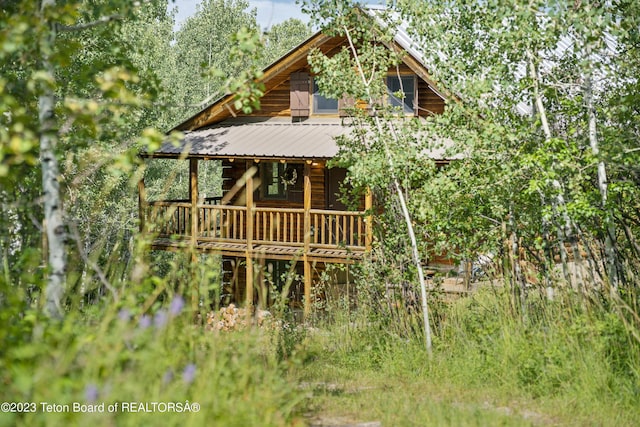 4821 S 2000 E, Victor, ID 83455 - back of property featuring covered porch and a metal roof