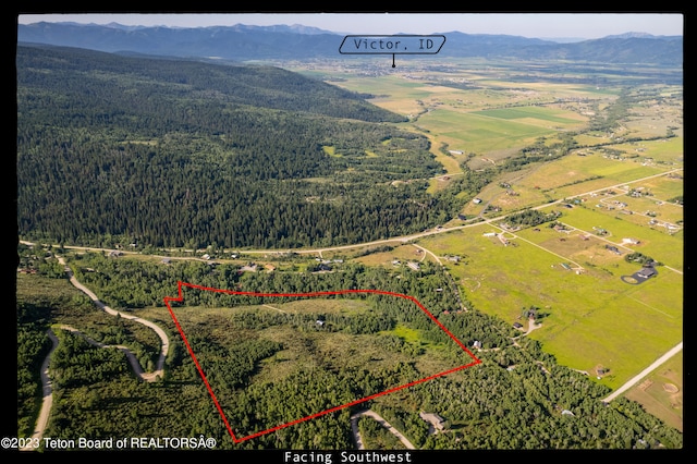 4821 S 2000 E, Victor, ID 83455 - aerial view of property's location with property parcel outlined and a mountain backdrop
