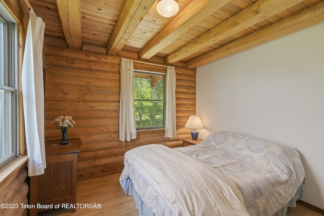 4821 S 2000 E, Victor, ID 83455 - bedroom featuring a wooden ceiling with exposed beams, rustic walls, and wood finished floors