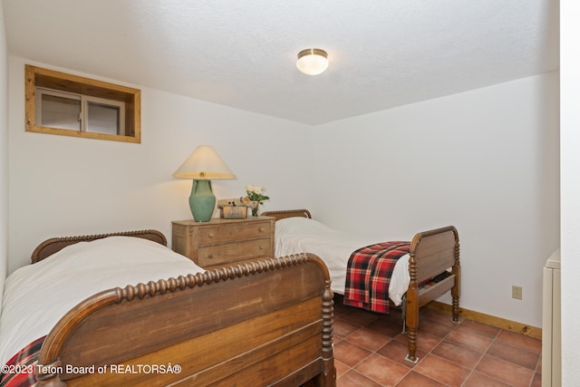 4821 S 2000 E, Victor, ID 83455 - bedroom featuring baseboards and tile patterned floors