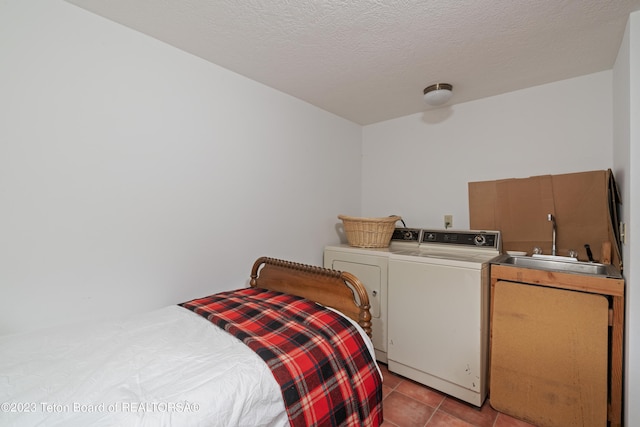 4821 S 2000 E, Victor, ID 83455 - bedroom with washing machine and dryer, tile patterned flooring, and a textured ceiling