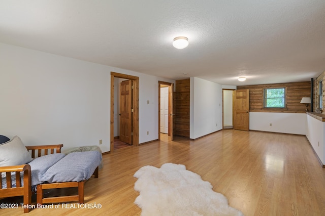 4821 S 2000 E, Victor, ID 83455 - living room with light wood-type flooring and a textured ceiling