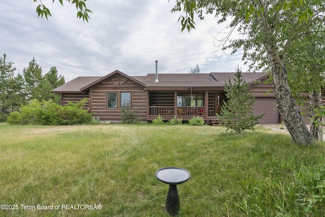73657339 Summer Breeze Trl, Tetonia, ID 83452 - log-style house featuring roof with shingles, an attached garage, and a front yard