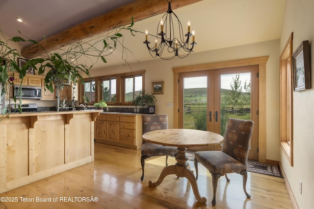 73657339 Summer Breeze Trl, Tetonia, ID 83452 - dining room with french doors, light wood-style flooring, and a chandelier