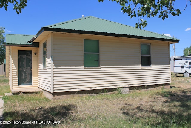 216 E Birch St, Labarge, WY 83123 - view of front facade with crawl space and a metal roof