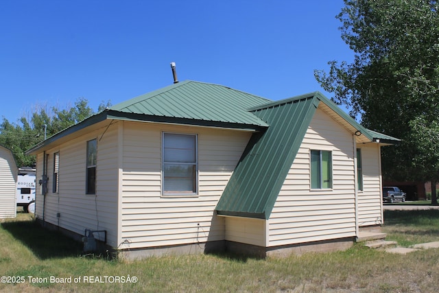 216 E Birch St, Labarge, WY 83123 - view of side of home with a metal roof