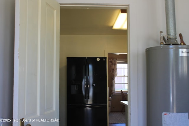 216 E Birch St, Labarge, WY 83123 - kitchen with black refrigerator with ice dispenser and water heater
