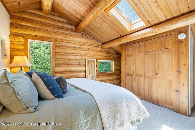 6250 W Paintbrush Trl, Wilson, WY 83014 - carpeted bedroom with wooden ceiling, a skylight, and rustic walls
