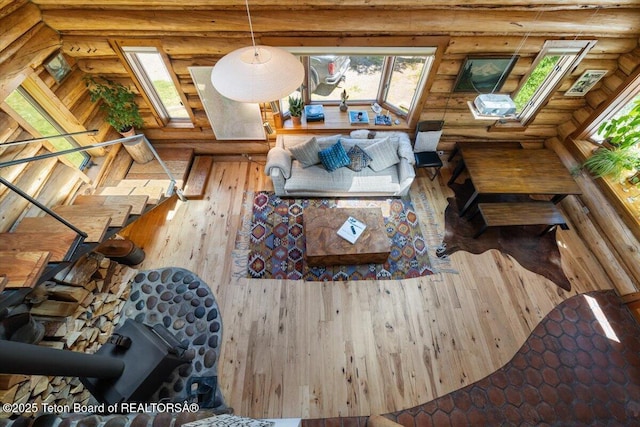 6250 W Paintbrush Trl, Wilson, WY 83014 - living area with log walls, hardwood / wood-style floors, and a skylight