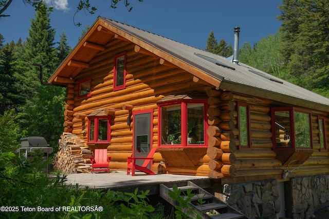 6250 W Paintbrush Trl, Wilson, WY 83014 - view of front of home featuring log siding and a metal roof
