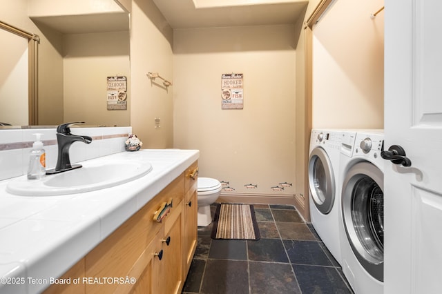 910 Powder Valley Rd Unit 20, Driggs, ID 83422 - bathroom featuring washer and dryer, stone finish floors, and vanity