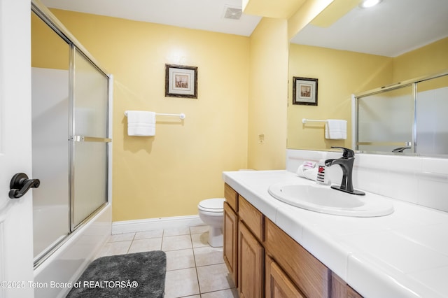 910 Powder Valley Rd Unit 20, Driggs, ID 83422 - bathroom featuring tile patterned flooring, vanity, and bath / shower combo with glass door