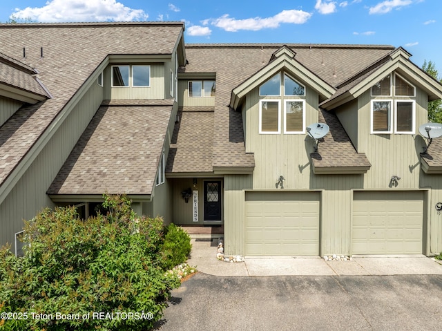 910 Powder Valley Rd Unit 20, Driggs, ID 83422 - townhome / multi-family property featuring asphalt driveway, an attached garage, and a shingled roof