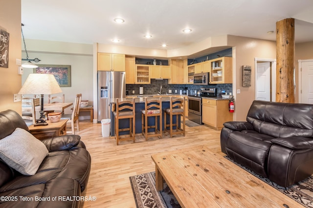 910 Powder Valley Rd Unit 20, Driggs, ID 83422 - living area featuring light wood finished floors and recessed lighting