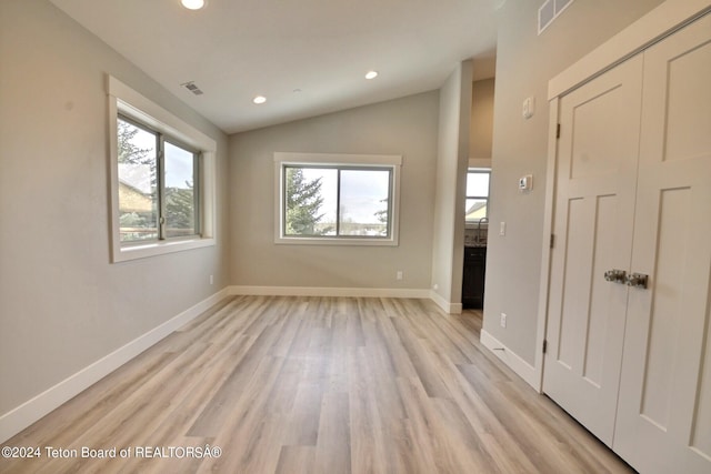 140 Homestead Rd Unit 508, Victor, ID 83455 - unfurnished living room with recessed lighting, light wood finished floors, and lofted ceiling