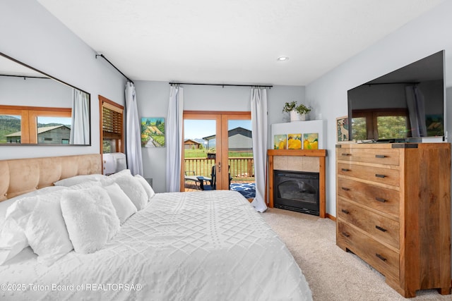 92 Ashley Dr, Alpine, WY 83128 - bedroom with carpet floors, access to outside, multiple windows, french doors, and recessed lighting