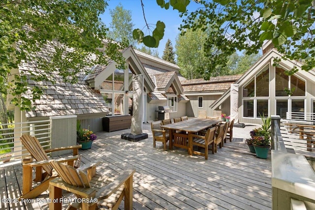 2620 N Fairways Pl W, Wilson, WY 83014 - wooden terrace featuring outdoor dining space and a grill