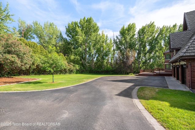 4976 S 49th, Idaho Falls, ID 83406 - view of asphalt driveway with view of scattered trees