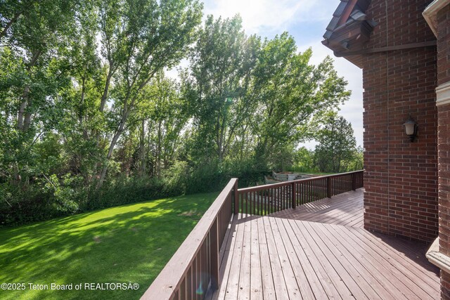 4976 S 49th, Idaho Falls, ID 83406 - deck featuring a lawn