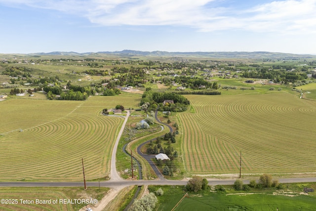4976 S 49th, Idaho Falls, ID 83406 - aerial view of property and surrounding area featuring a mountainous background and rural landscape