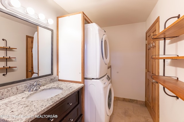 55 Virginian Ln Unit 55-2, Jackson, WY 83002 - washroom featuring stacked washer / dryer and light stone finish flooring