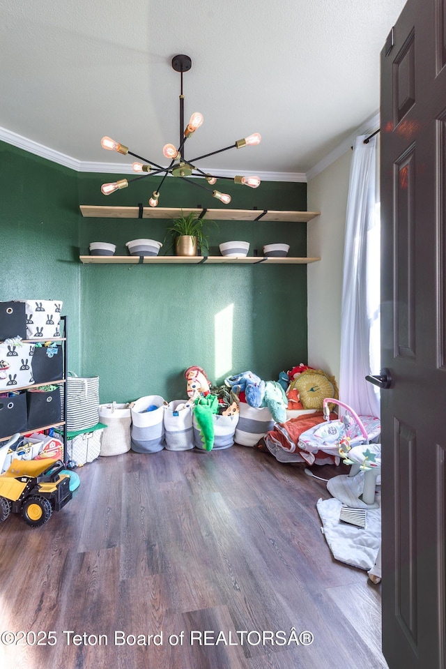 26 Merrimac Trl, Boulder, WY 82923 - bedroom featuring crown molding, wood finished floors, and a chandelier
