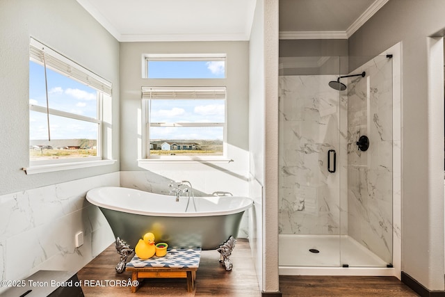 26 Merrimac Trl, Boulder, WY 82923 - bathroom featuring ornamental molding, a marble finish shower, a soaking tub, and wood finished floors