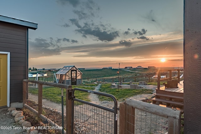 26 Merrimac Trl, Boulder, WY 82923 - yard at dusk with a shed and a gate