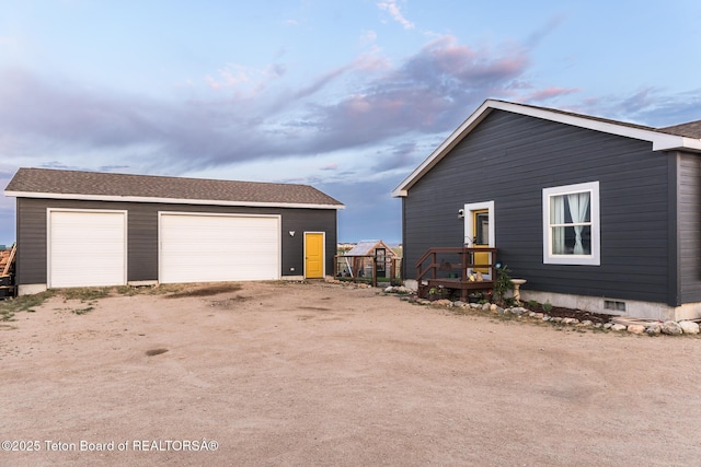 26 Merrimac Trl, Boulder, WY 82923 - view of side of property featuring a detached garage, an outbuilding, and a deck