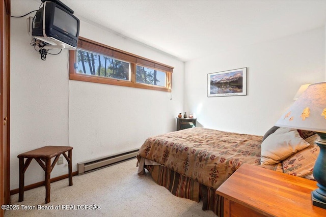 3705 N Teton Dr # 914, Wilson, WY 83014 - bedroom featuring baseboard heating and carpet floors