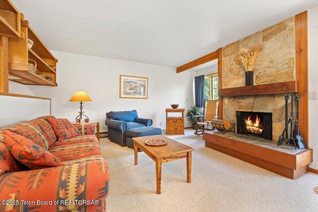 3705 N Teton Dr # 914, Wilson, WY 83014 - living area with light colored carpet, a fireplace, and a baseboard radiator