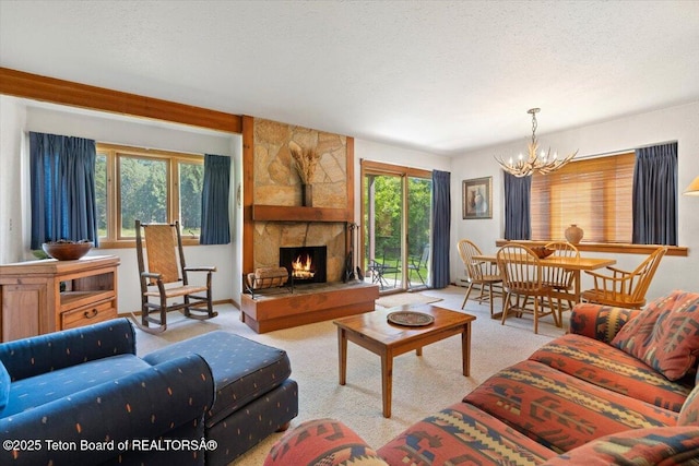 3705 N Teton Dr # 914, Wilson, WY 83014 - living area with a chandelier, carpet, a stone fireplace, and a textured ceiling