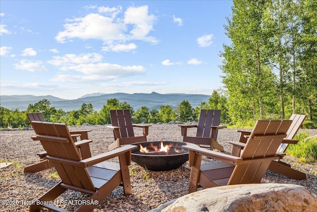 20 Trail Ride Ln, Cora, WY 82925 - view of patio / terrace featuring an outdoor fire pit and a mountain view