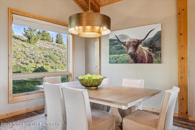 20 Trail Ride Ln, Cora, WY 82925 - dining area featuring beam ceiling, wood finished floors, plenty of natural light, and a textured wall