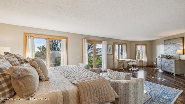 20 Trail Ride Ln, Cora, WY 82925 - bedroom with access to outside, a textured ceiling, and wood finished floors