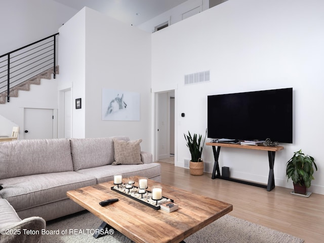 112 Aspen Meadows Rd Unit 36, Driggs, ID 83422 - living room with a high ceiling, wood finished floors, and stairway