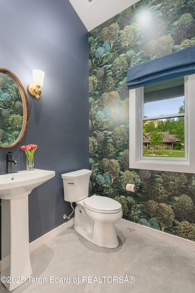 4345 Melody Ranch Dr, Jackson, WY 83001 - half bath with wallpapered walls and baseboards