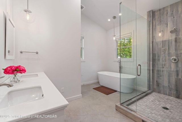 4345 Melody Ranch Dr, Jackson, WY 83001 - bathroom with double vanity, a freestanding bath, vaulted ceiling, and a shower stall