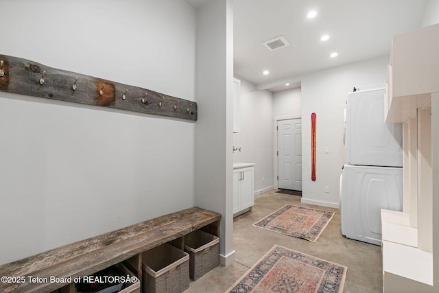 4345 Melody Ranch Dr, Jackson, WY 83001 - mudroom featuring stacked washer / dryer, finished concrete floors, and recessed lighting