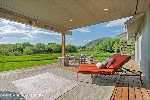 4345 Melody Ranch Dr, Jackson, WY 83001 - wooden deck with a mountain view, outdoor lounge area, and a yard